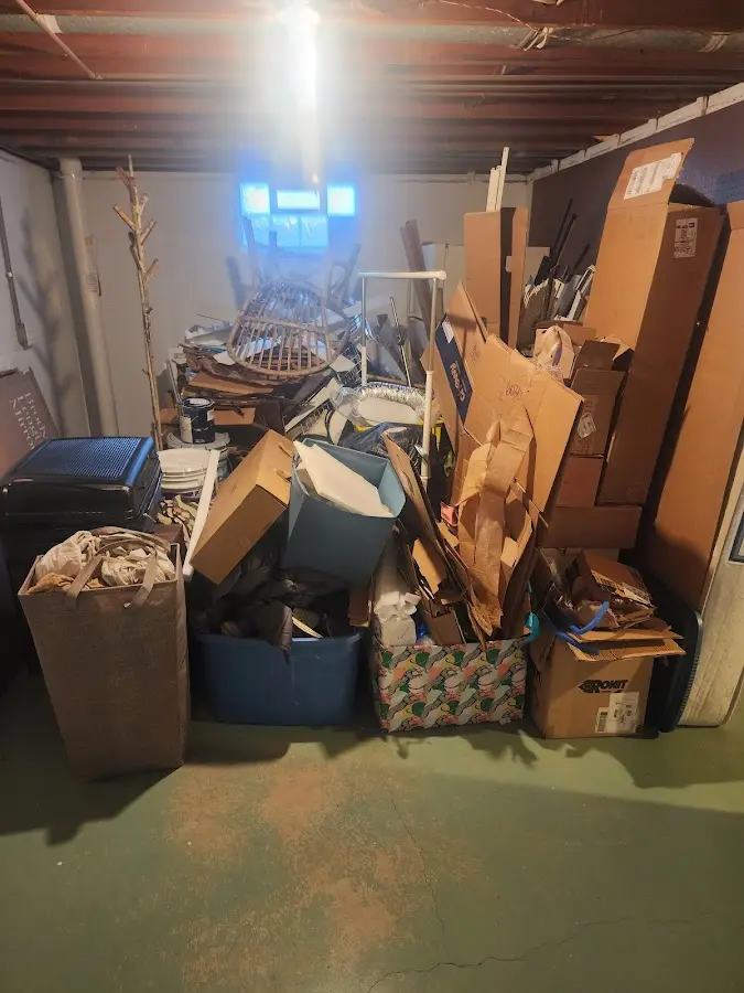 Roll-off dumpster container at job site for 2 Yard Dumpster Rental in Collier