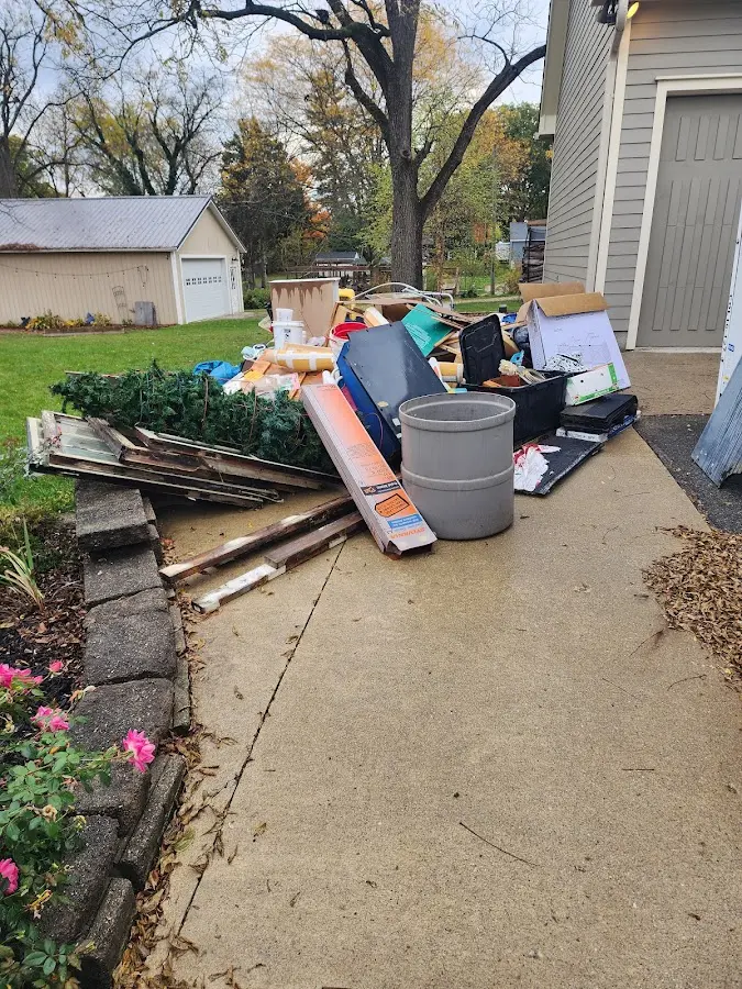 Dumpster being loaded with debris for Residential Dumpster Rental in Collier